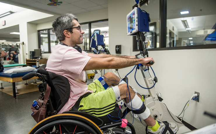 Male client seated on a RTI FES bicycle.