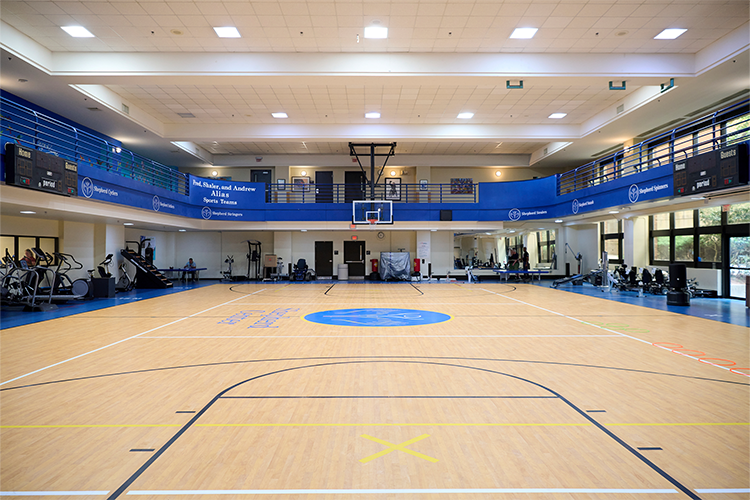 Empty view of the The Livingston Gym at Shepherd Center featuring a basketball court and indoor track