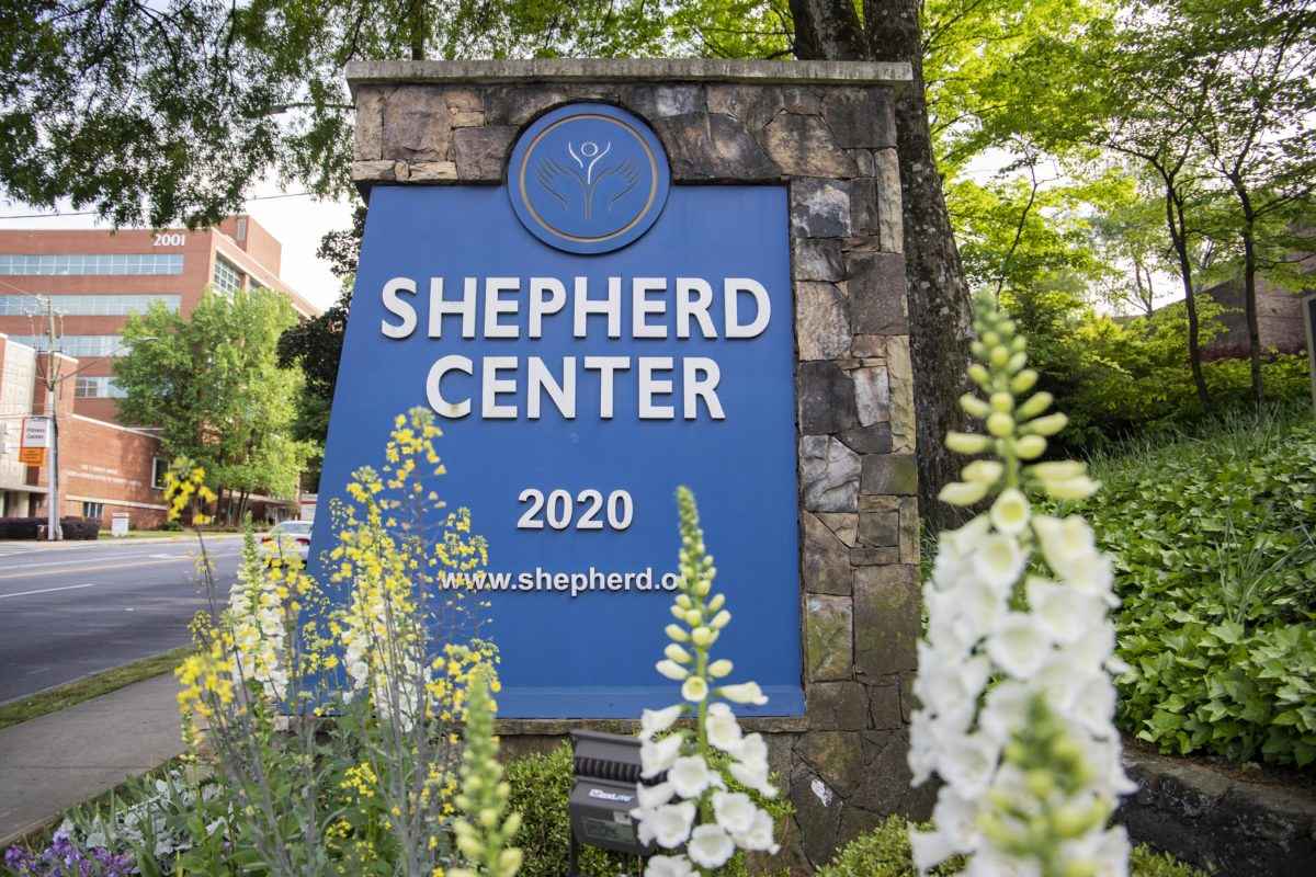 Sign for Shepherd Center with blue background and white text, displaying 